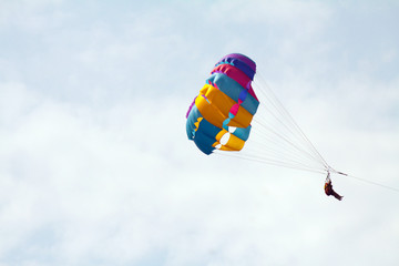 Parasailing in a blue sky