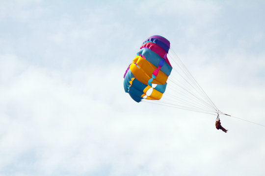 Parasailing in a blue sky