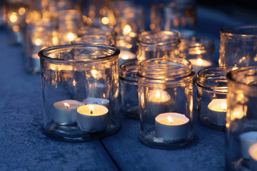 Many lantern made of glass and tealight glowing in the night © hans_chr