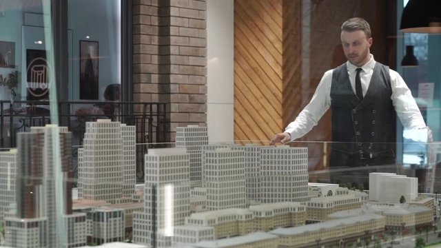 Architect is walking around his layout