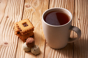 Cup of Tea with Cookies on wooden background