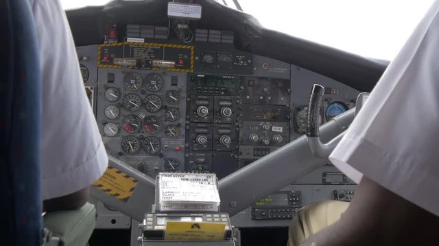 Pilot and co-pilot inside the airplane cockpit