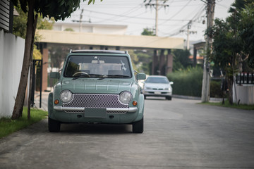 Fototapeta na wymiar Vintage classic car parked in a street
