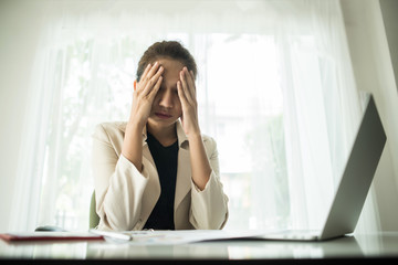 Young business people are suffering from headaches