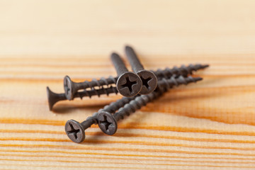 screws on a wooden table