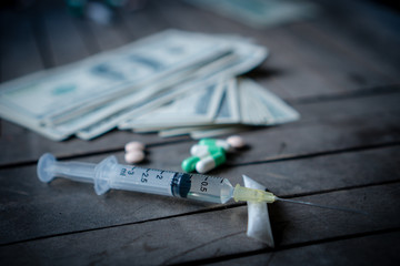 Drug addiction - cocaine, heroin, syringes.selected focus
