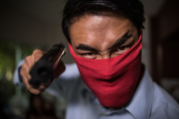 man with pistol handgun weapon