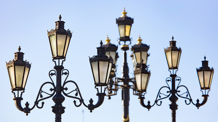 Fototapeta na wymiar Ancient street lamp on the sky background