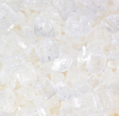 Fototapeta na wymiar White granulated sugar as a background
