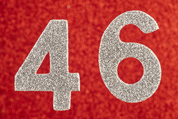 Number forty-six silver color over a red background. Anniversary. Horizontal