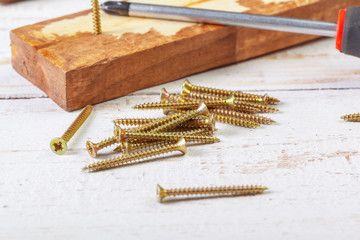 screws on a wooden table