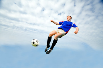 Fototapeta na wymiar Man playing Soccer