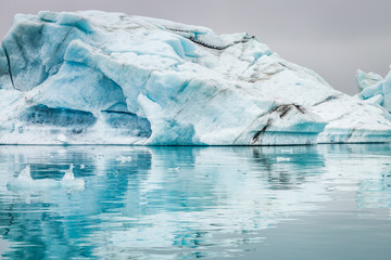 Stunning icebergs floating on blue lake, Iceland
