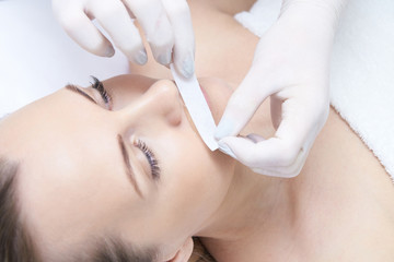 Obraz na płótnie Canvas Cosmetic procedure for hair removal. Bright skin. Beauty and health
