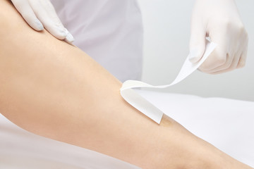 Depilation legs. Cosmetic procedure. Beauty and health. Bright skin