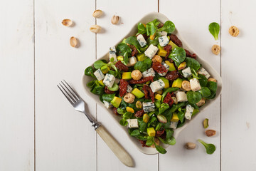 Italian salad with avocado, gorgonzola cheese.