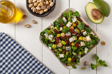 Italian salad with avocado, gorgonzola cheese.