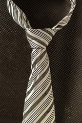 tie on dark background