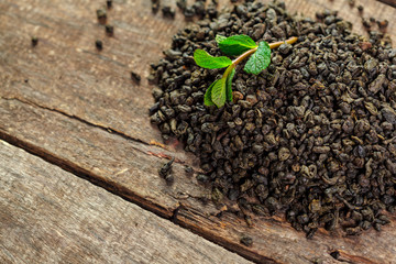 Dry tea on wooden table background