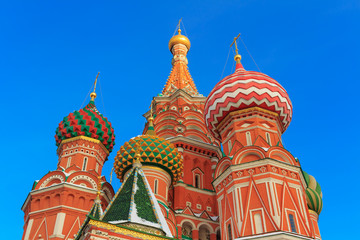 Fototapeta na wymiar Domes of St. Basil's Cathedral in the rays of the winter sun in Moscow