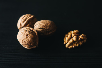 Walnuts kernels    with color background, Whole walnuts in wood vintage bowl. rustic