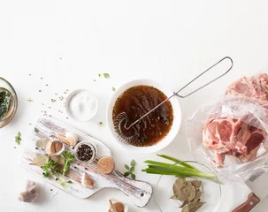Zelfklevend Fotobehang Cooking meat marinade on kitchen white table © ekramar