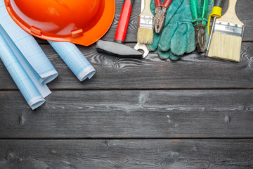 Assorted work tools on wooden table