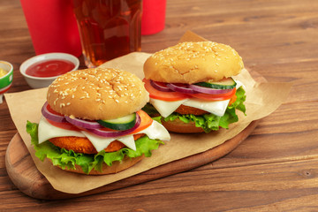 Fast food, homemade burger on a wooden background