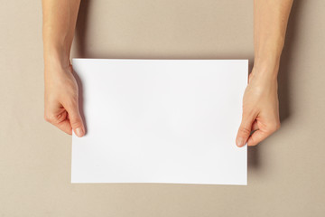Fototapeta premium Hand holding papers a4 size