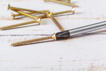 screws on a wooden table