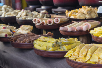 Pancakes, sausages and other food on the counter