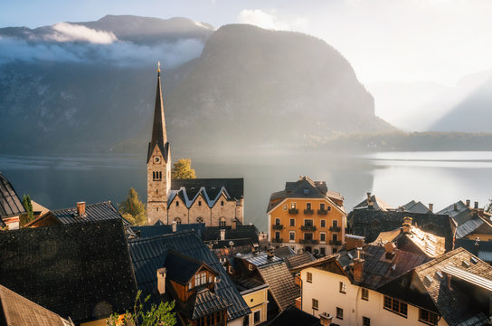 Scenic view of famous Hallstatt town on Hallstattersee lake in the Austrian Alps in morning light with bright clouds, Salzkammergut region, Austria