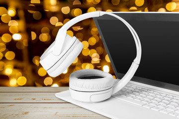 Headphones with laptop on table