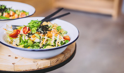 Green Goddess Buddha Bowl on wooden table. Healthy eating, food photography concept. Copyspace, horizontal