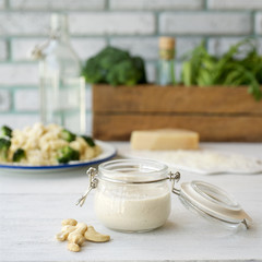 Vegan cashew cream sauce for pasta. Light wooden background
