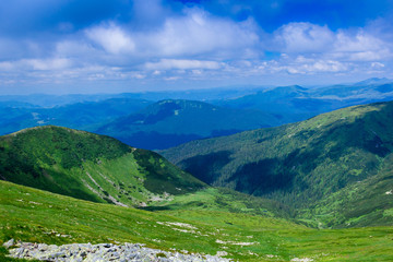 Fototapeta na wymiar landscape of a Carpathians mountains with grassy valley, rocky and sky