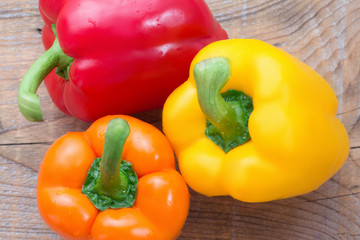 Three different-colored peppers