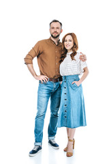 full length view of beautiful happy couple standing together and smiling at camera isolated on white