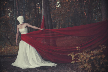 The young model is posing with a surreal character