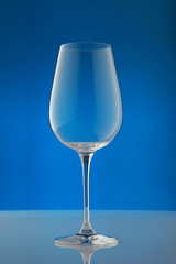 empty wineglass/ empty wineglass on blue background