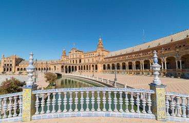 a beautiful view from on top of the bridge in front of the Plaza De Espana Seville, Spain