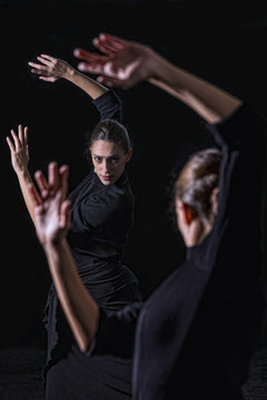 Dancer rehearsing before a mirror