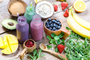 Purple and light red fresh smoothie with coconut sugar, blueberry, fruits, oats and seeds, selective focus. Clean eating, detox, dieting, vegetarian, vegan, fitness, healthy lifestyle concept, 
