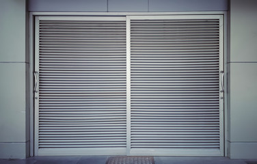 Aluminum shutter door with horizontal pattern. 