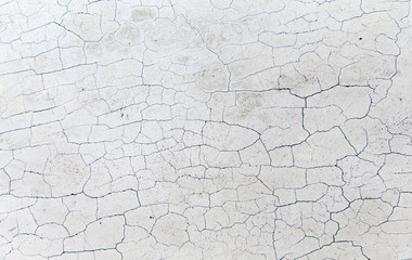 background and texture concept - close up of cracked stone wall or surface