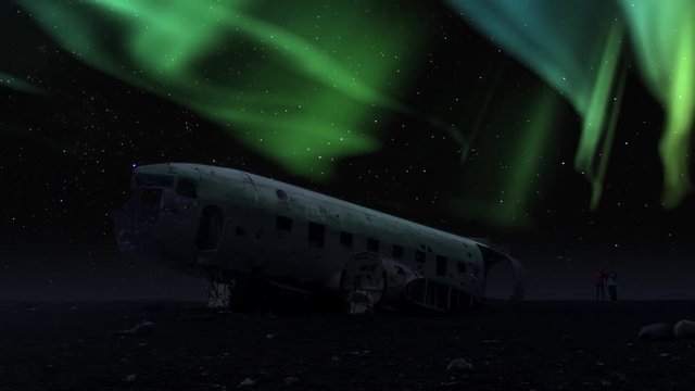 aurora borealis crashed DC-3 Plane Solheimasandur winter sky tourism night timelapse