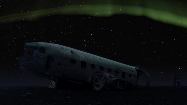 aurora borealis crashed DC-3 Plane Solheimasandur winter sky tourism night timelapse