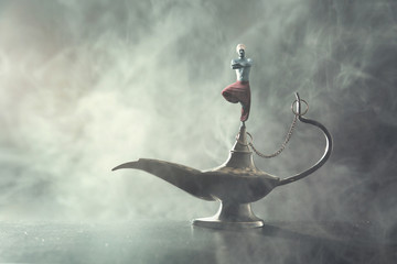 Genie coming out of a whishes lamp - obrazy, fototapety, plakaty