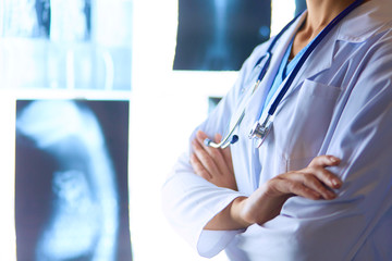 Image of attractive woman doctor looking at x-ray results.