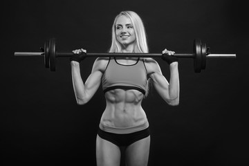 Fototapeta na wymiar Woman lifting weight